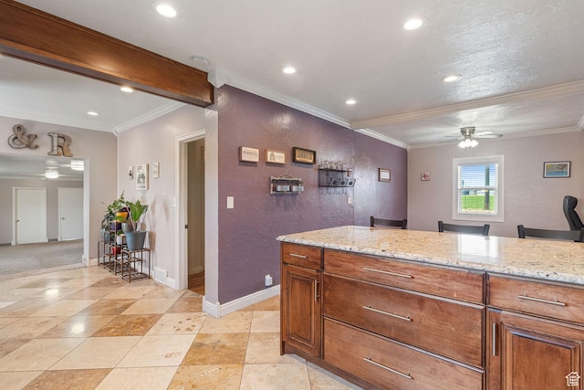 2214 S 1600 E, Preston, ID 83263 - kitchen with a ceiling fan, ornamental molding, recessed lighting, light stone counters, and brown cabinets