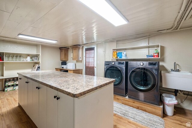 2214 S 1600 E, Preston, ID 83263 - laundry area featuring separate washer and dryer and light wood-style flooring