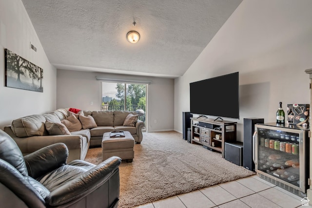 1245 E Privet Dr S Unit B3-427, Cottonwood Heights, UT 84121 - carpeted living area featuring vaulted ceiling, beverage cooler, a textured ceiling, and tile patterned floors