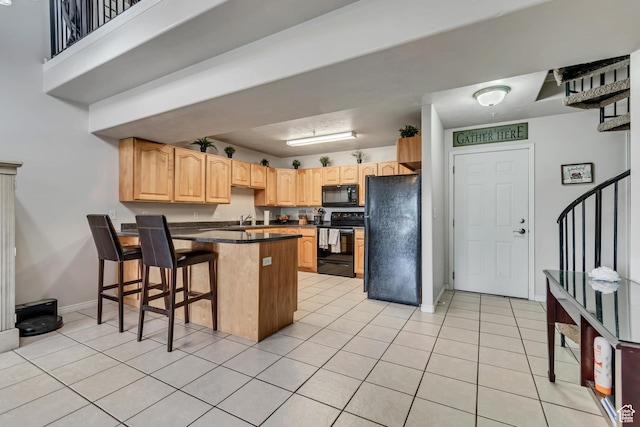 1245 E Privet Dr S Unit B3-427, Cottonwood Heights, UT 84121 - kitchen with black appliances, a peninsula, dark countertops, and light tile patterned floors