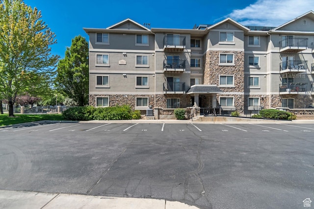 1245 E Privet Dr S Unit B3-427, Cottonwood Heights, UT 84121 - view of apartment building / complex with uncovered parking