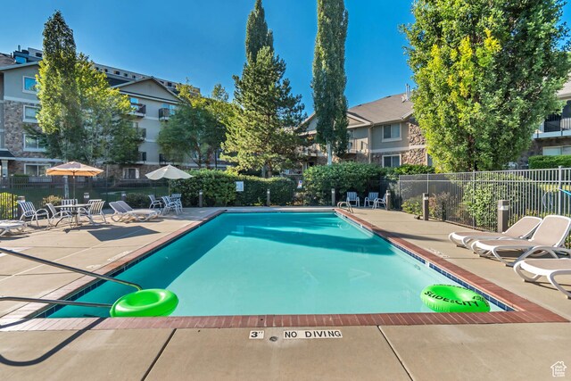 1245 E Privet Dr S Unit B3-427, Cottonwood Heights, UT 84121 - community pool featuring a patio