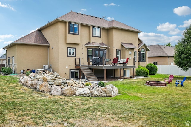 3195 N 1350 W, Pleasant View, UT 84414 - rear view of property featuring a fire pit, stairway, a deck, and stucco siding