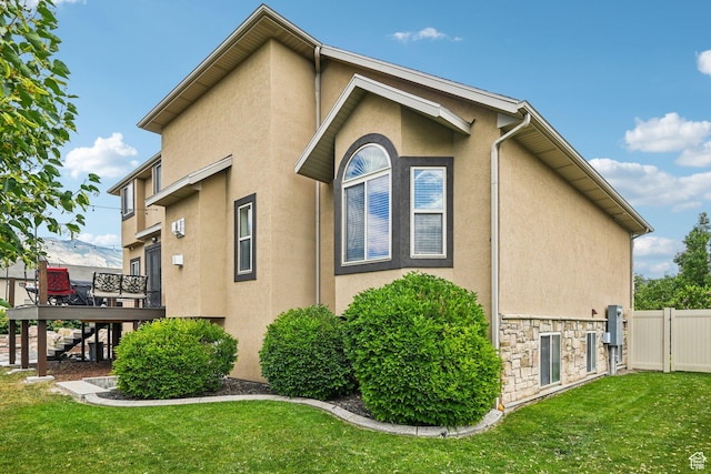 3195 N 1350 W, Pleasant View, UT 84414 - view of side of property featuring stairway, stucco siding, a wooden deck, and stone siding