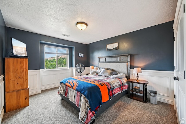3195 N 1350 W, Pleasant View, UT 84414 - carpeted bedroom featuring a textured ceiling and wainscoting
