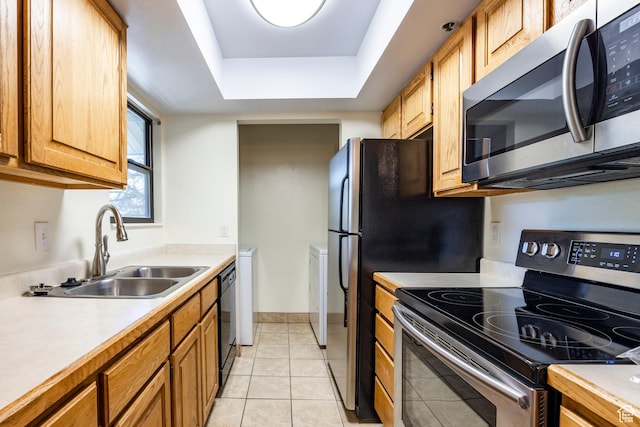 6955 N 2200 W Unit 4E, Park City, UT 84098 - kitchen with appliances with stainless steel finishes, light countertops, a raised ceiling, and light tile patterned floors