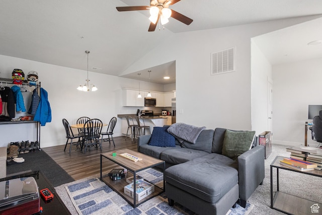 3637 W 1480 N Unit 302, Lehi, UT 84043 - living area with vaulted ceiling, ceiling fan, wood finished floors, and a chandelier