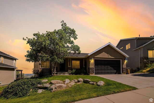 383 E Manti Dr S, Draper, UT 84020 - view of front of house with a garage, stucco siding, a lawn, concrete driveway, and stone siding