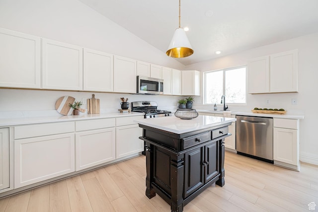 383 E Manti Dr S, Draper, UT 84020 - kitchen with appliances with stainless steel finishes, white cabinetry, light countertops, lofted ceiling, and recessed lighting