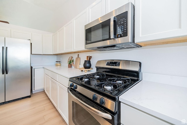 383 E Manti Dr S, Draper, UT 84020 - kitchen with stainless steel appliances, white cabinets, and light wood-style flooring
