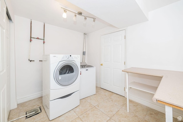 383 E Manti Dr S, Draper, UT 84020 - laundry area with washing machine and dryer, light tile patterned floors, and rail lighting