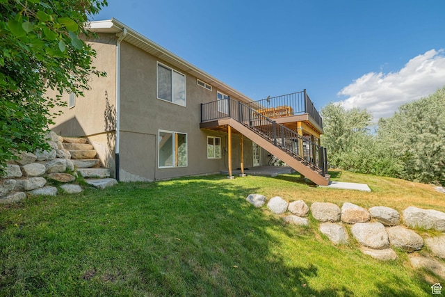 383 E Manti Dr S, Draper, UT 84020 - back of house featuring stairway, a wooden deck, a yard, and stucco siding
