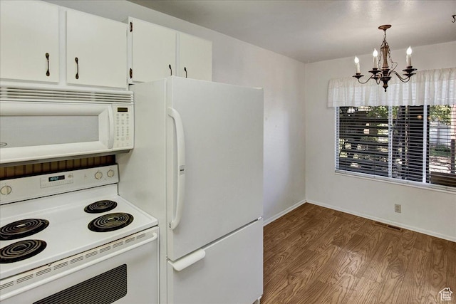 1917 S Main St Unit 7A, Bountiful, UT 84010 - kitchen with white appliances, dark wood-type flooring, a chandelier, white cabinetry, and light countertops