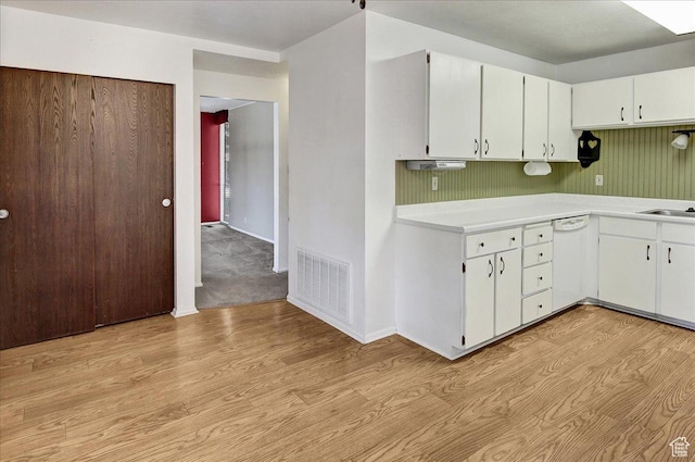 1917 S Main St Unit 7A, Bountiful, UT 84010 - kitchen with light wood-style floors, light countertops, white dishwasher, and white cabinets