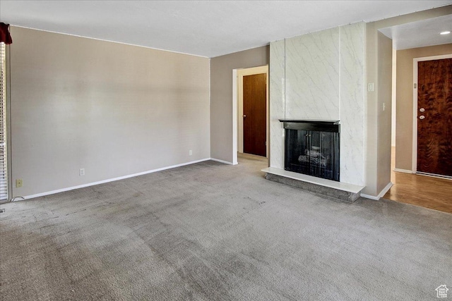 1917 S Main St Unit 7A, Bountiful, UT 84010 - unfurnished living room featuring carpet and a high end fireplace