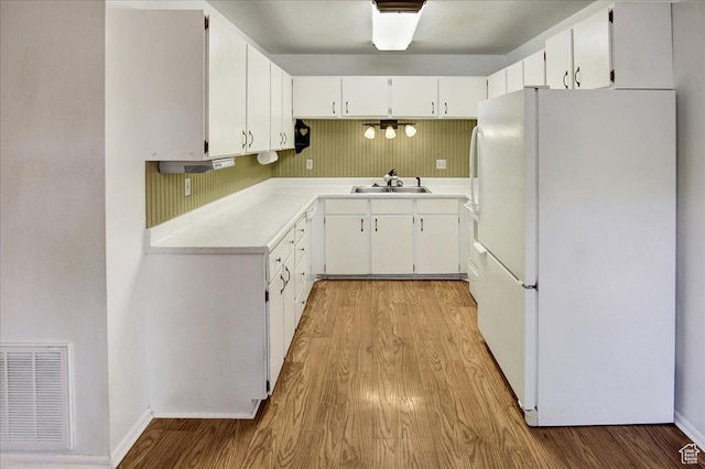 1917 S Main St Unit 7A, Bountiful, UT 84010 - kitchen with freestanding refrigerator, light wood-style floors, and light countertops