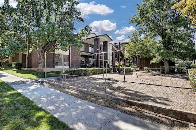 1917 S Main St Unit 7A, Bountiful, UT 84010 - view of front of house featuring volleyball court and brick siding