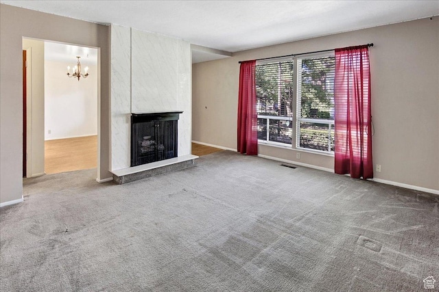 1917 S Main St Unit 7A, Bountiful, UT 84010 - unfurnished living room featuring a chandelier, carpet, and a fireplace
