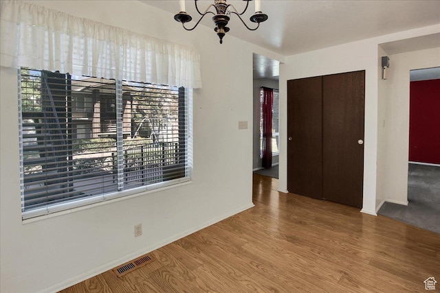 1917 S Main St Unit 7A, Bountiful, UT 84010 - unfurnished dining area with a chandelier, healthy amount of natural light, and wood finished floors