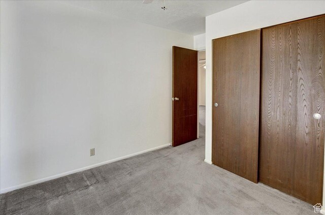 1917 S Main St Unit 7A, Bountiful, UT 84010 - unfurnished bedroom featuring carpet flooring and a closet