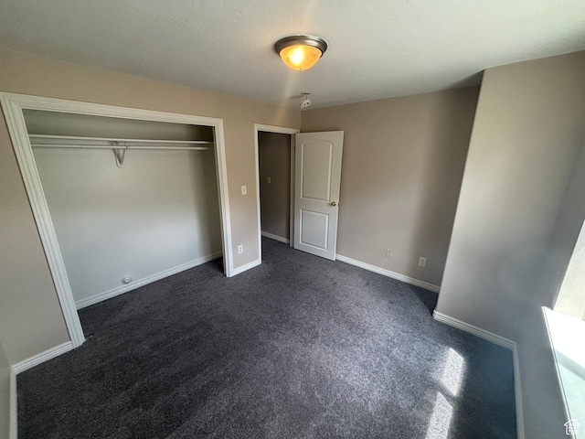 576 S 400 E, Santaquin, UT 84655 - unfurnished bedroom featuring dark colored carpet and a closet