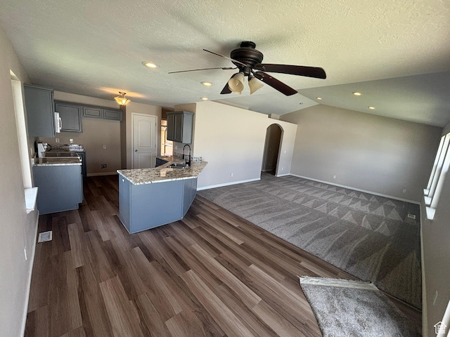 576 S 400 E, Santaquin, UT 84655 - kitchen featuring ceiling fan, dark wood-style floors, arched walkways, gray cabinetry, and recessed lighting