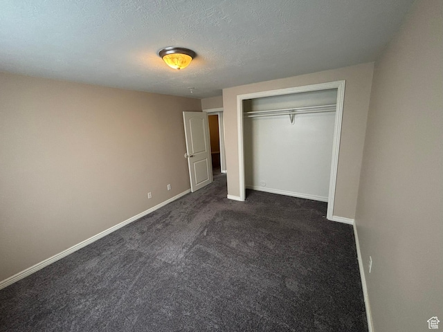576 S 400 E, Santaquin, UT 84655 - unfurnished bedroom featuring dark colored carpet, a closet, and a textured ceiling