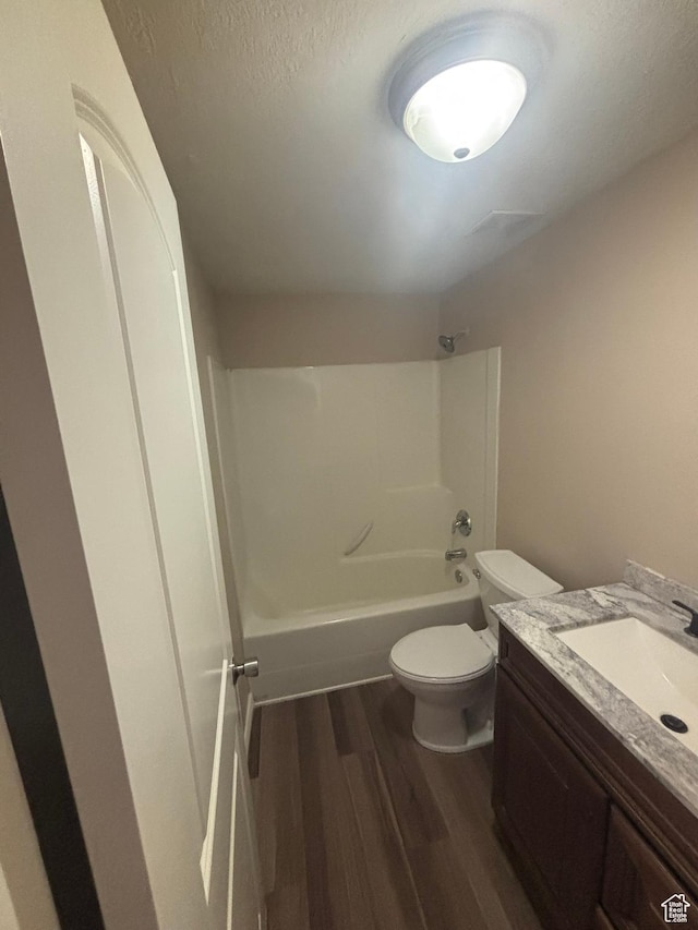 576 S 400 E, Santaquin, UT 84655 - bathroom featuring wood finished floors,  shower combination, vanity, and a textured ceiling