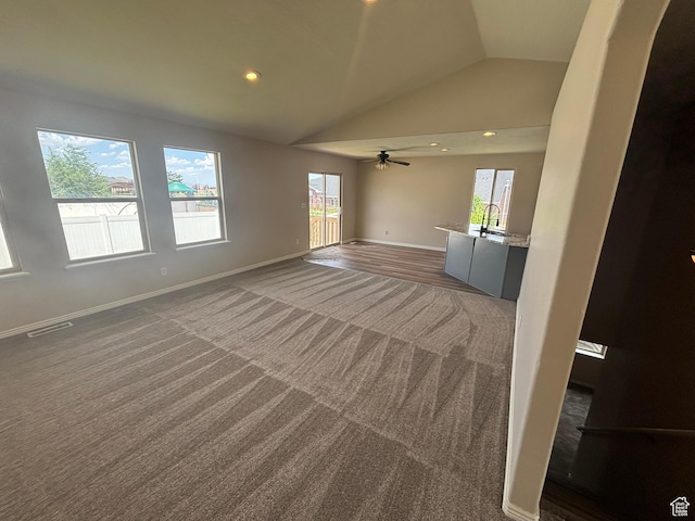 576 S 400 E, Santaquin, UT 84655 - unfurnished living room featuring carpet flooring, healthy amount of natural light, lofted ceiling, recessed lighting, and ceiling fan