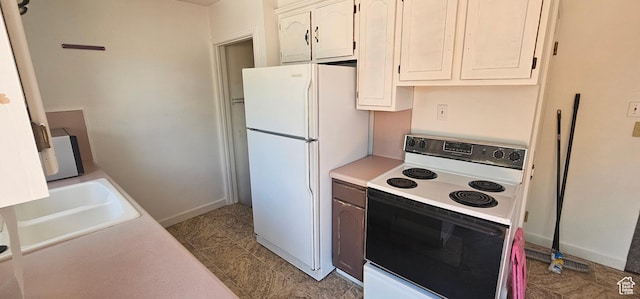 660 N 300 E, Price, UT 84501 - kitchen with white appliances, light countertops, and white cabinets