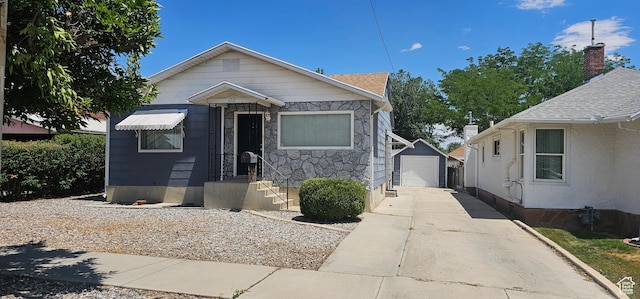660 N 300 E, Price, UT 84501 - bungalow-style house featuring driveway, a garage, an outbuilding, and stone siding