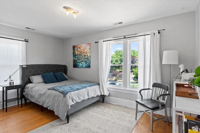 368 S 1100 E, Salt Lake City, UT 84102 - bedroom featuring wood finished floors and baseboards