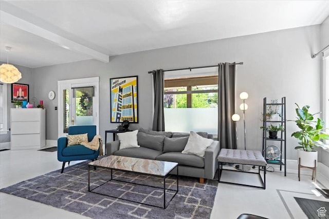 368 S 1100 E, Salt Lake City, UT 84102 - living area with plenty of natural light, beamed ceiling, and finished concrete floors