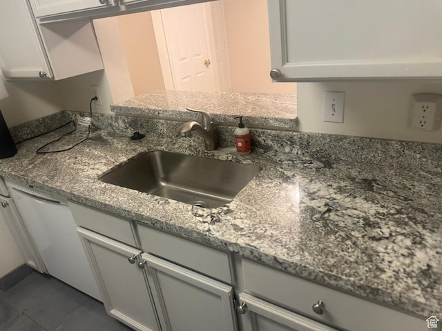 550 400 E Unit 3307, Salt Lake City, UT 84111 - kitchen with dishwasher, dark stone counters, and dark tile patterned floors
