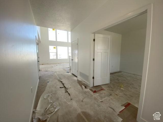 432 W Sapphire Dr Unit 7012, Tooele, UT 84074 - hallway with a textured ceiling
