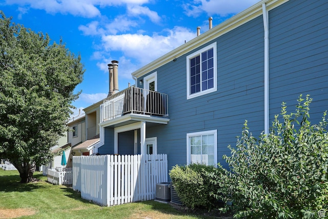 1428 W Beacon Hill Cir S Unit 1428, Salt Lake City, UT 84123 - view of property exterior with a balcony and a cooling unit