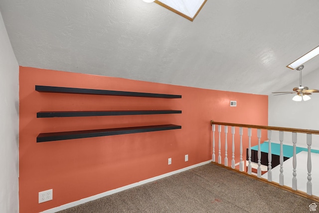 1428 W Beacon Hill Cir S Unit 1428, Salt Lake City, UT 84123 - carpeted empty room with vaulted ceiling, ceiling fan, and a skylight