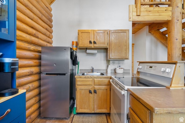 5 Mirror Lake Hwy Unit 5-2, Coalville, UT 84017 - kitchen featuring freestanding refrigerator, white electric range, rustic walls, and light countertops