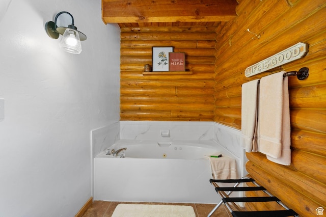 5 Mirror Lake Hwy Unit 5-2, Coalville, UT 84017 - bathroom with rustic walls, beam ceiling, a tub with jets, and tile patterned flooring
