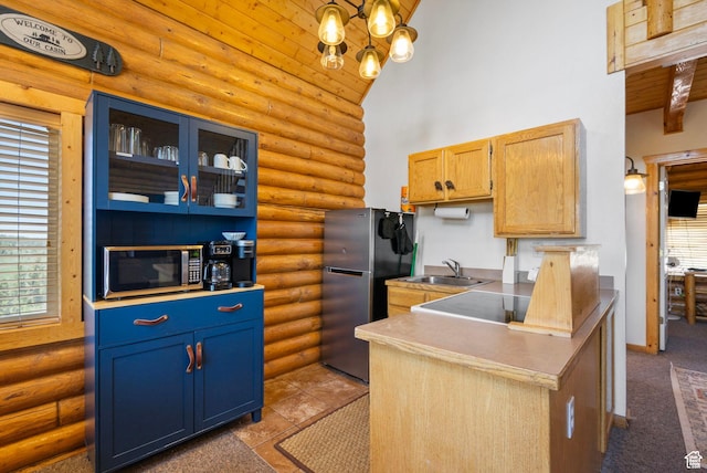 5 Mirror Lake Hwy Unit 5-2, Coalville, UT 84017 - kitchen with rustic walls, stainless steel appliances, high vaulted ceiling, healthy amount of natural light, and glass insert cabinets