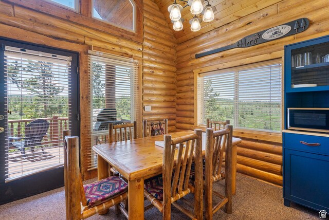5 Mirror Lake Hwy Unit 5-2, Coalville, UT 84017 - dining space with log walls, a chandelier, and carpet flooring