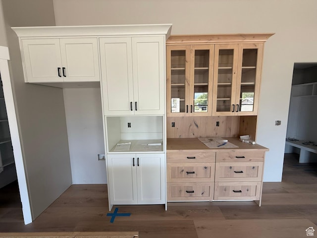 3274 N 2500 W, Farr West, UT 84404 - kitchen featuring glass insert cabinets, wood finished floors, white cabinets, and light countertops