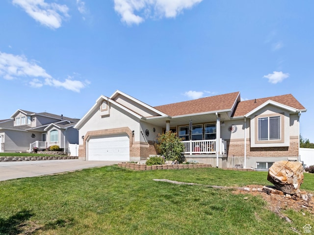 3646 S Elk Point Dr, Magna, UT 84044 - single story home featuring covered porch, brick siding, driveway, and a garage