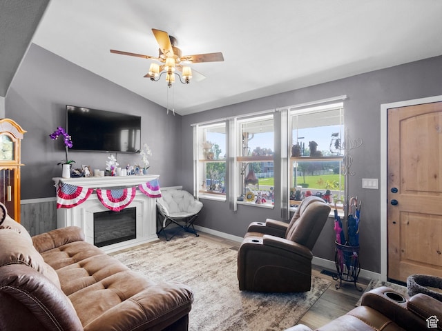 3646 S Elk Point Dr, Magna, UT 84044 - living area with vaulted ceiling, ceiling fan, wood finished floors, and a fireplace