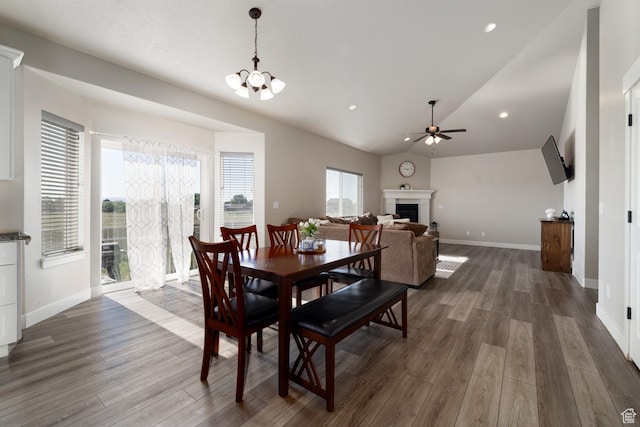 933 S 250 W, Vernal, UT 84078 - dining area featuring dark wood-style flooring, ceiling fan, lofted ceiling, a fireplace, and recessed lighting
