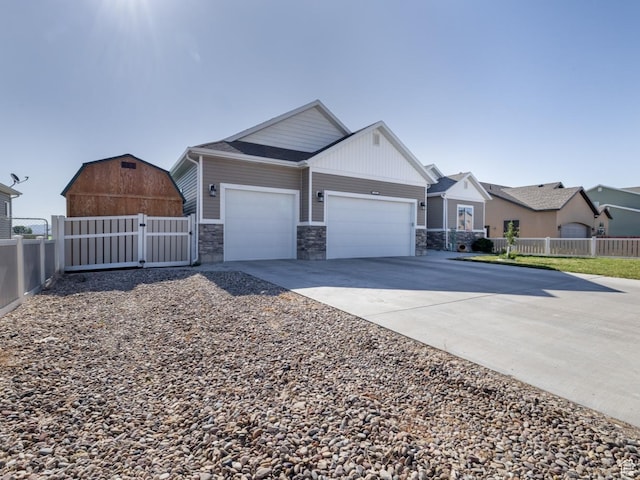 933 S 250 W, Vernal, UT 84078 - view of front of property with a garage, a gate, concrete driveway, and stone siding