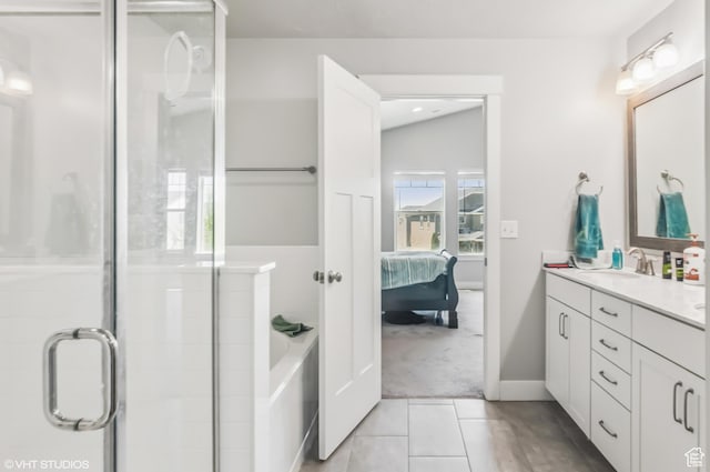 2086 W White Pine Dr S, Layton, UT 84041 - ensuite bathroom featuring double vanity, a stall shower, a garden tub, and tile patterned flooring
