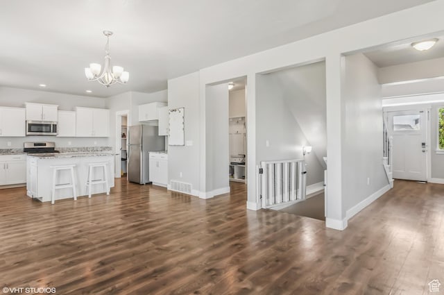2086 W White Pine Dr S, Layton, UT 84041 - kitchen featuring stainless steel appliances, dark wood finished floors, white cabinets, a chandelier, and recessed lighting