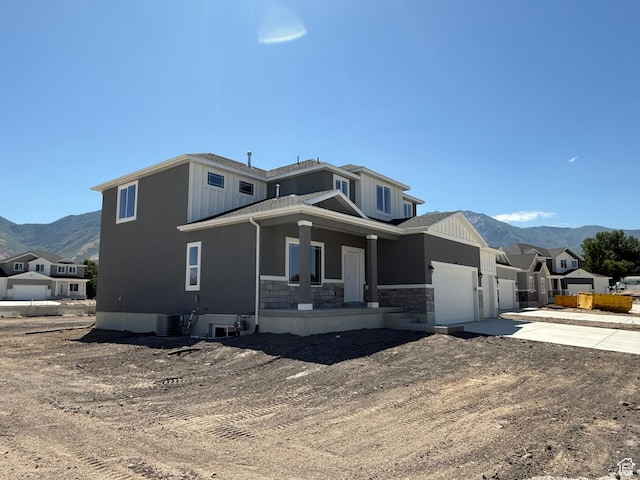 482 N 460 E Lot 6, Salem, UT 84653 - view of front of property featuring a porch, a mountain view, concrete driveway, a garage, and stone siding
