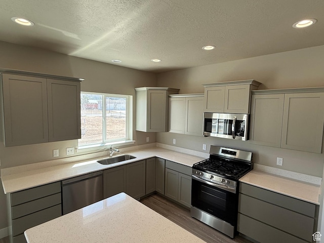 482 N 460 E Lot 6, Salem, UT 84653 - kitchen featuring appliances with stainless steel finishes, gray cabinets, dark wood-style flooring, recessed lighting, and a textured ceiling